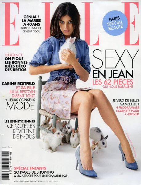 Rabbit-themed fashion shoot featuring a young woman in stylish denim and floral skirt, surrounded by adorable rabbits, emphasizing contemporary fashion, animal photography, and playful elegance.