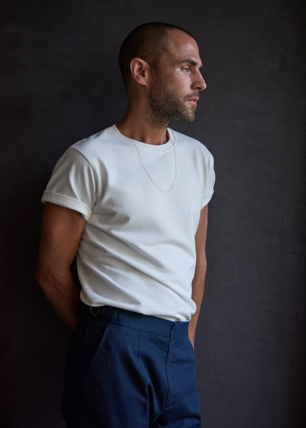 Men's fashion portrait by Pamela Hanson photography showcasing casual elegant style with minimalist wardrobe, clean lines, and sophisticated mood for high-end fashion editorial.