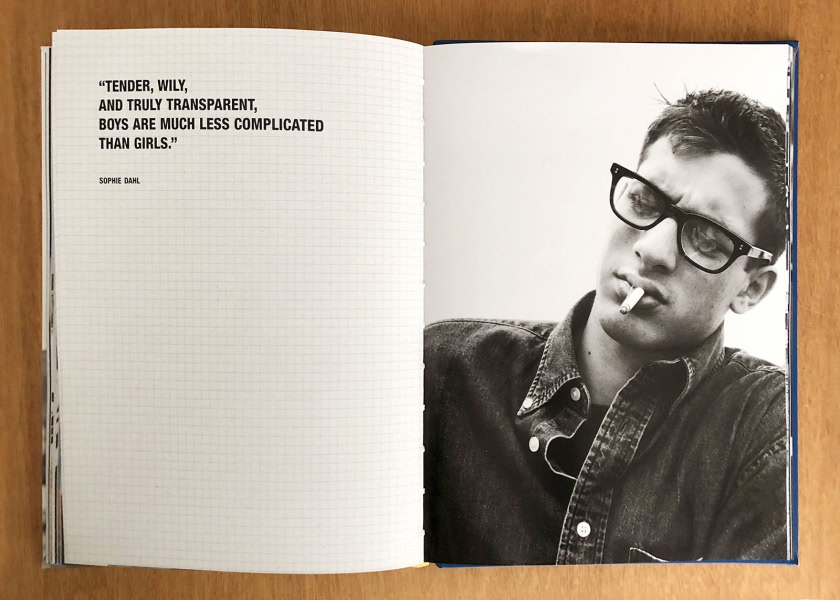 Black and white portrait of a young man wearing sunglasses and a denim jacket with a cigarette in his mouth, captured in a candid, high-contrast photography style by Pamela Hanson Photography.