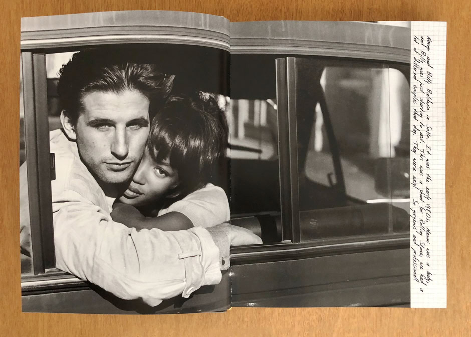 Sleek black and white fashion photography featuring a male and female model embracing through a car window, highlighting elegance and intimacy in editorial portraits.