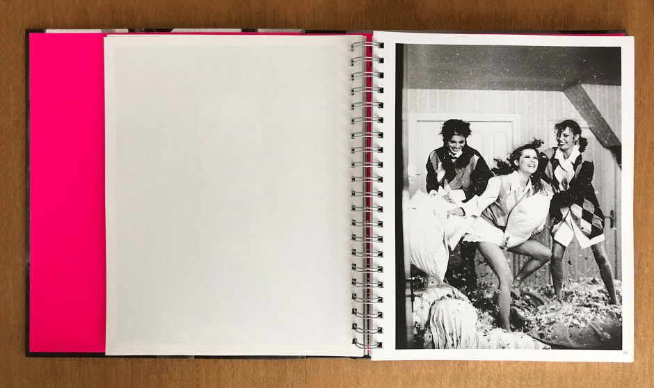 Dancing girls in playful motion black and white photo, vintage fashion photoshoot, candid moment, expressive models, artistic black and white photography, Pamela Hanson Photography, studio and indoor setting.