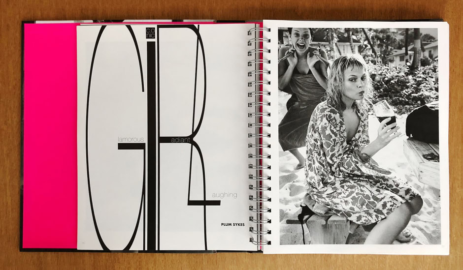 Vibrant black and white candid portrait of two women enjoying a relaxed outdoor moment, one sipping a drink through a straw, capturing authentic lifestyle and fashion photography.