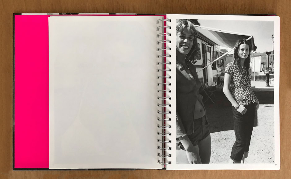 Vintage black and white photograph of two women standing outdoors near RVs, showcasing lifestyle and portrait photography by Pamela Hanson, with a carefree and stylish vibe.