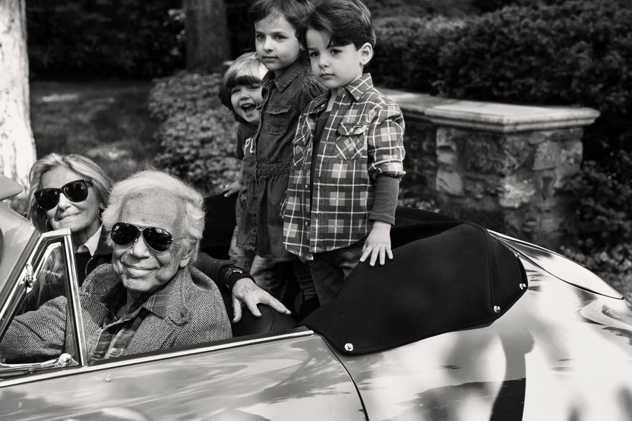 Family enjoying a nostalgic moment in a classic convertible car, capturing candid expressions and timeless style, perfect for vintage and family photography portfolios.