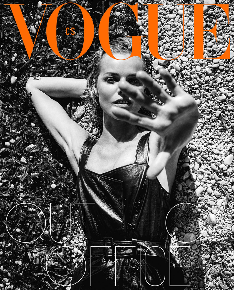 Vogue magazine cover featuring a black and white photograph by Pamela Hanson, showcasing her high-end fashion photography style with a model lying on a pebble beach wearing a leather dress.