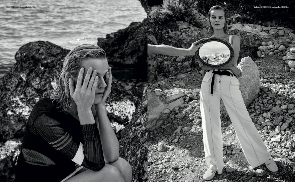 Black and white fashion photography of a woman sitting by the rocks near the sea, expressive portrait, creative fashion shoot, artistic black and white images, outdoor model photography.