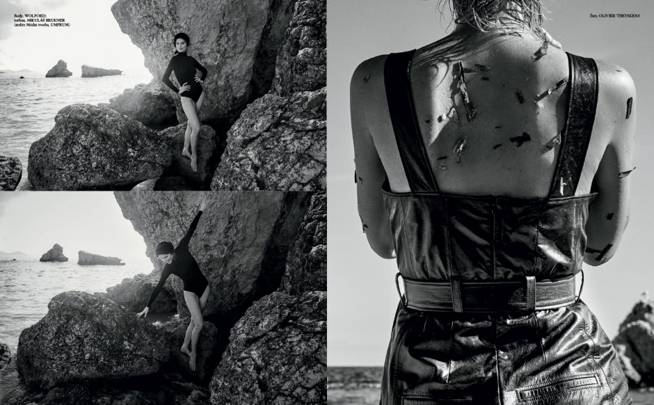 Rock-clad female model photography on rugged seashore, black and white artistic fashion shot, high-concept editorial image with dramatic contrasts and textures, elegant and edgy style, inspired by Pamela Hanson Photography.