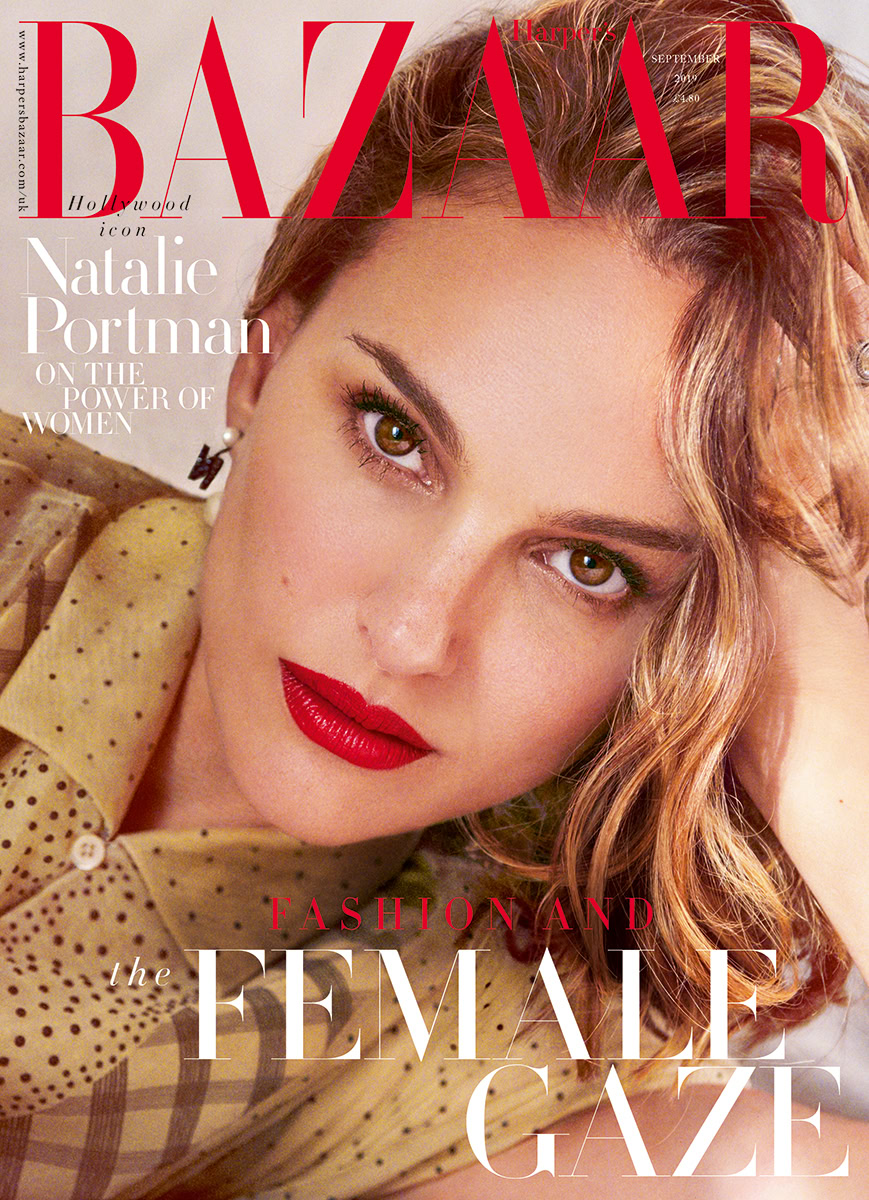 Portrait of a woman with red hair and bold makeup on the cover of Harper's Bazaar, emphasizing fashion, beauty, and female empowerment, styled by Pamela Hanson.
