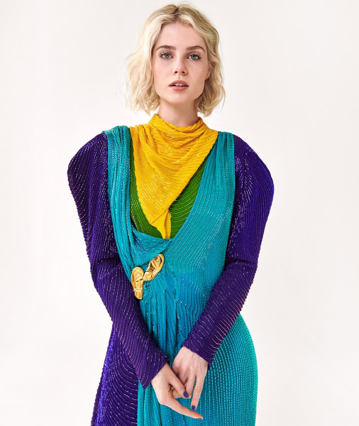 Vibrant fashion portrait of a woman wearing colorful textured dress with yellow and green accents, styled by Pamela Hanson Photography, showcasing contemporary editorial fashion photography.