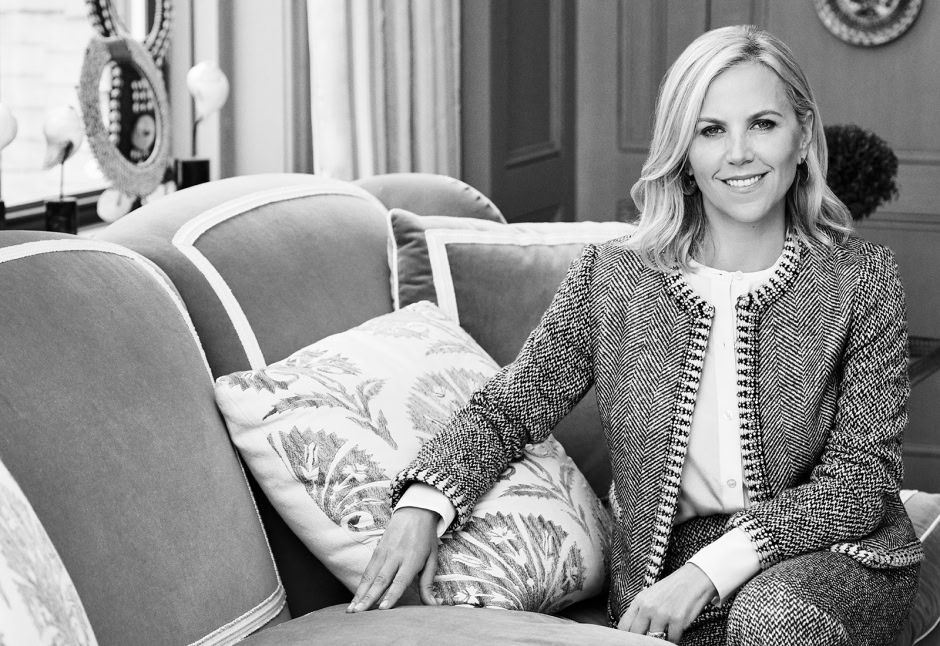 Elegant woman sitting on a vintage sofa in a sophisticated interior setting, captured by Pamela Hanson Photography, showcasing high-end lifestyle and portrait photography.