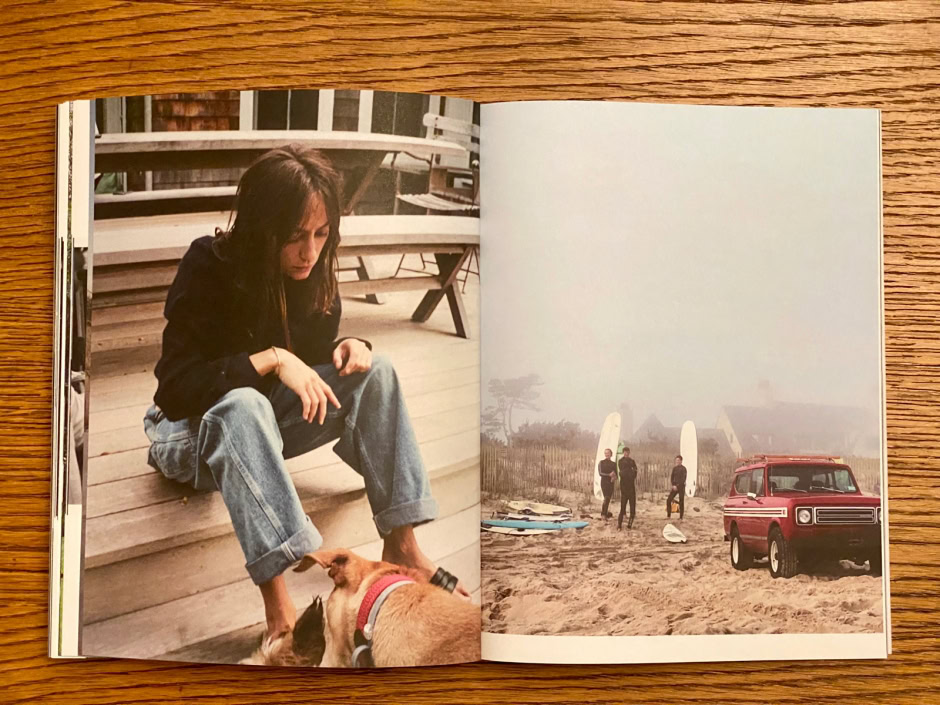 Young woman sitting on wooden stairs with a dog, casual fashion, relaxed lifestyle, outdoor setting.