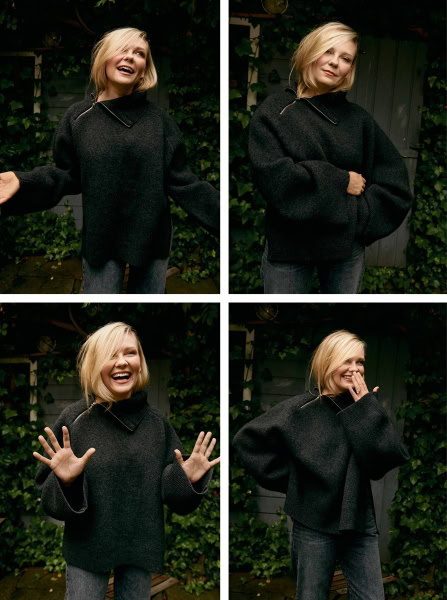 Portrait of a smiling blonde woman in a black sweater, showcasing candid and joyful moments, outdoor garden setting, professional photography by Pamela Hanson.