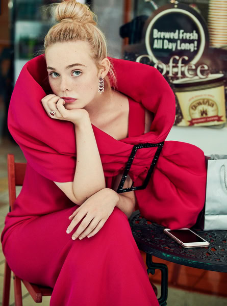 Elegant red dress woman portrait by Pamela Hanson Photography, showcasing fashion and beauty photography at a cafe.