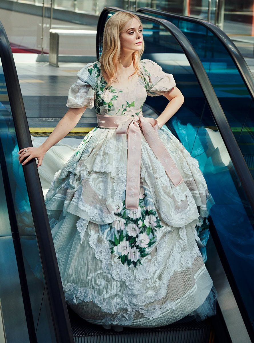 Luxury fashion model wearing an elegant floral gown on escalator, high-end fashion photography for bridal or couture collections, modern urban setting photography, Pamela Hanson Photography.