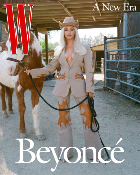 Elegant woman in cowboy-inspired fashion holding a horse's lead at a rural stable, showcasing high-end fashion photography and equestrian style.