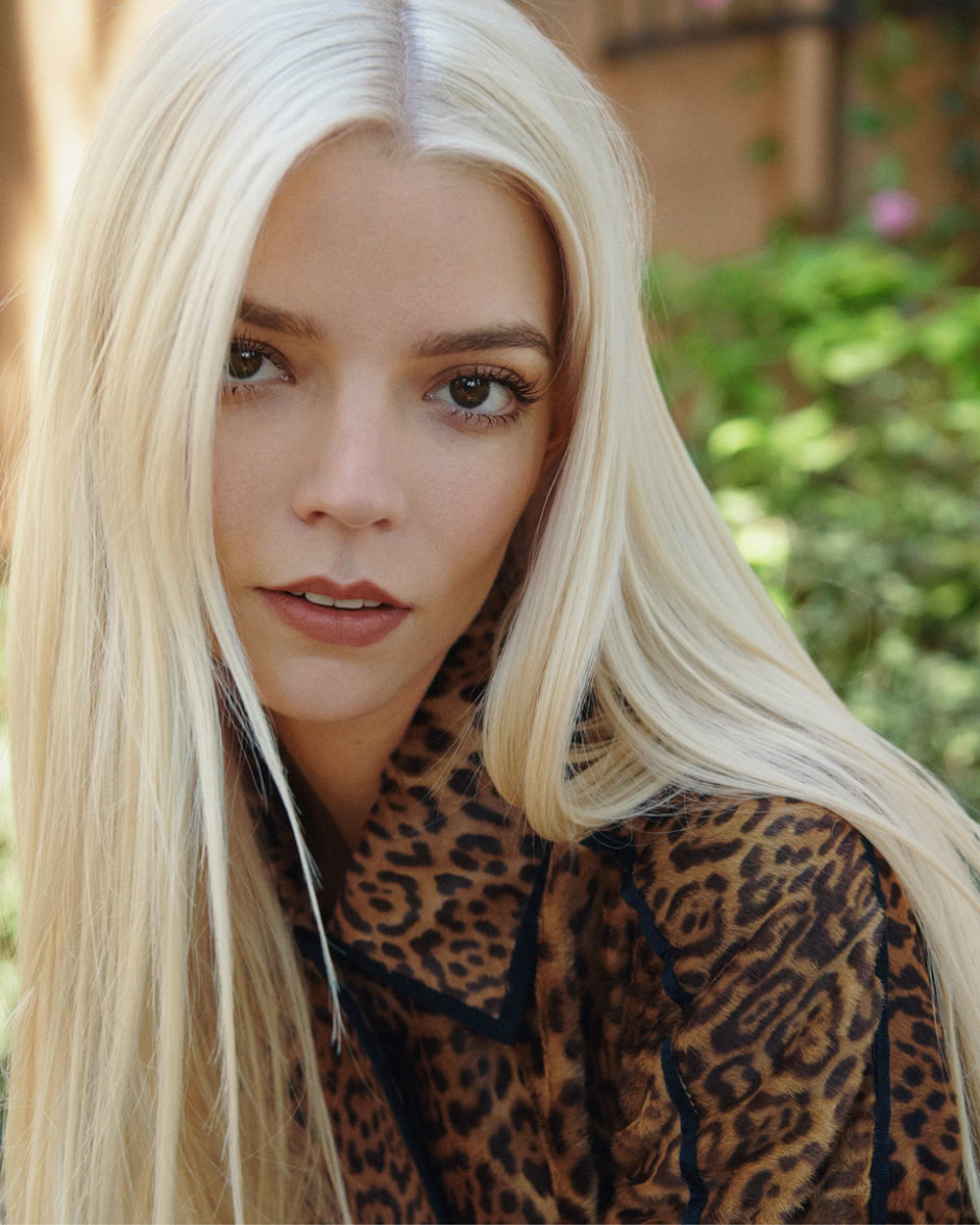 Blonde woman with striking eyes in leopard print jacket outdoors, fashion photography, beauty portrait, natural lighting, Pamela Hanson Photography.