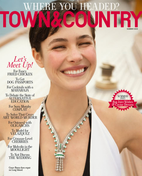 Luxury jewelry fashion photography by Pamela Hanson for Town & Country magazine, close-up of a smiling woman wearing an elegant diamond and emerald necklace, summer 2025 issue, high-end editorial style.