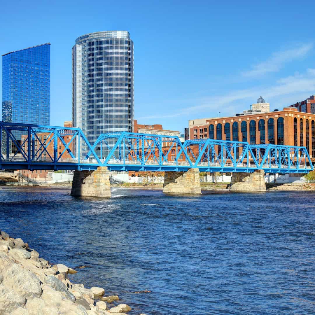 Grand rapids mi downtown with bridge, water, and tall buildings