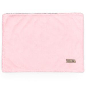 Soft pink puppy spa blanket from Paws With Fashion, perfect for pet grooming and comfort, featuring a small label with paw print design.