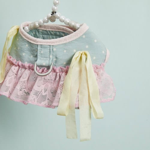 Pink and blue polka dot dog harness with lace ruffle, yellow ribbon bows, and pearl handle, stylish pet accessory from Paws With Fashion.