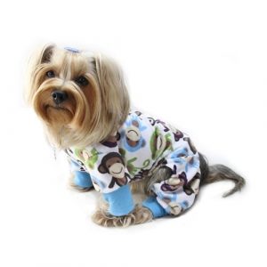 Cute small dog wearing stylish animal print pajamas, perfect for pet fashion and comfort.