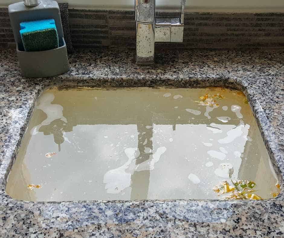 A full kitchen sink caused by a clogged drain