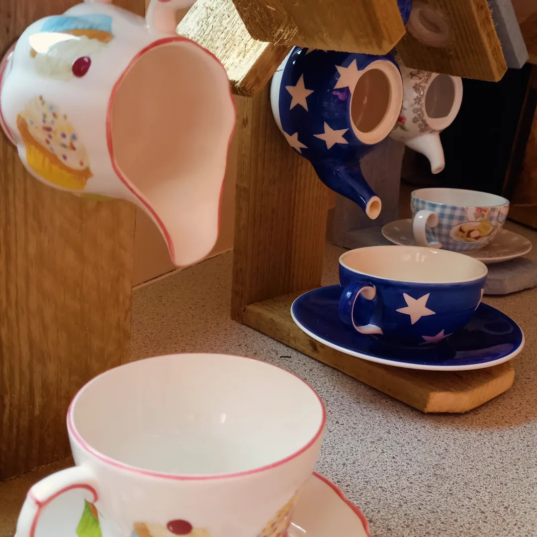 Upcycled bird feeders made from repurposed ceramics, perfect for attracting garden birds. Unique, ec.