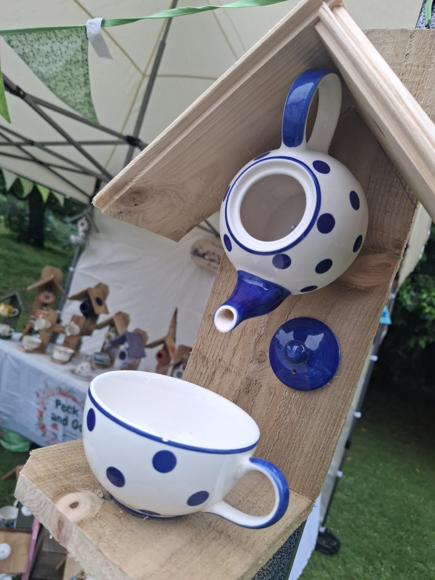 Handcrafted blue polka dot bird feeder and matching cup for garden birds. Eco-friendly upcycled cera.