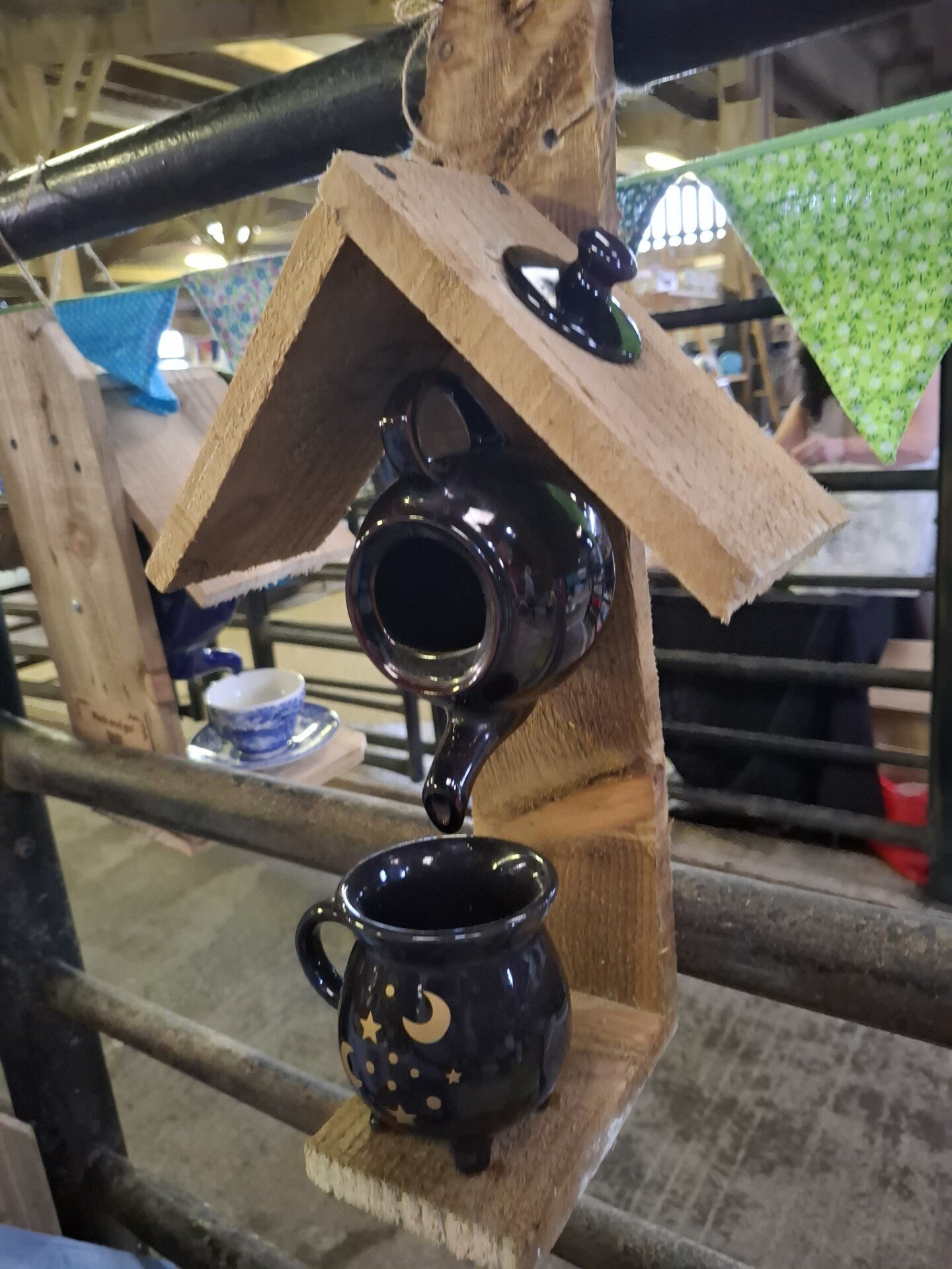 Rustic wooden hanging ornament with black teapot and moon mug
