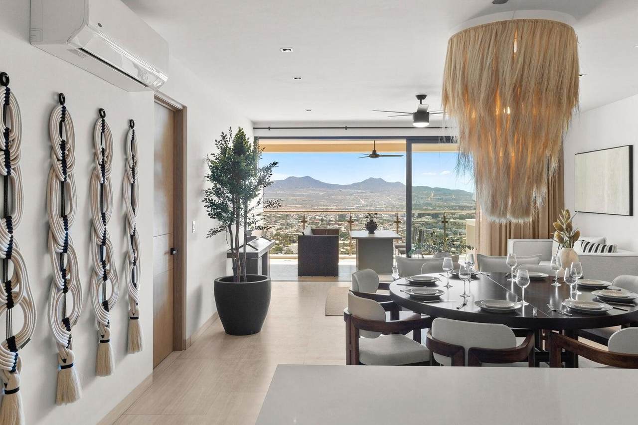 Monteluna – Homes For Sale In Pedregal Luxury Interior Dining Area With Panoramic City And Mountain Views In Pedregal, Showcasing Modern Design And Elegant Decor.