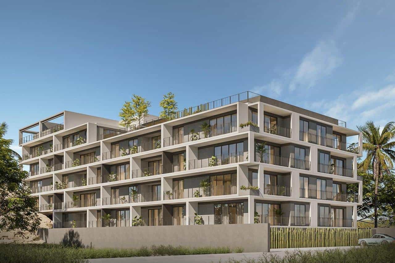 Contemporary Pedregal Apartment Building With Spacious Balconies, Modern Design, And Lush Surrounding Greenery Under A Clear Blue Sky.