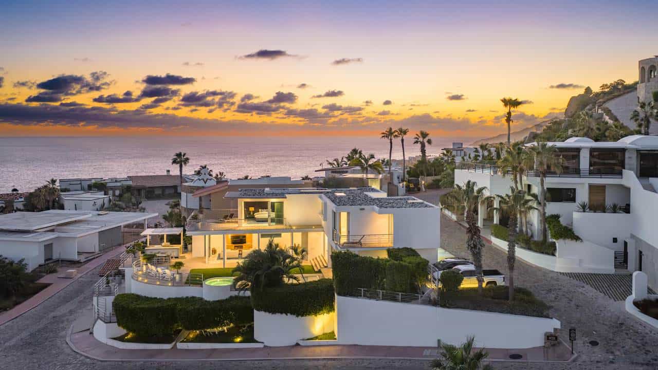 Luxurious Pedregal Beachfront Home At Sunset Featuring Modern Architecture And Ocean Views.