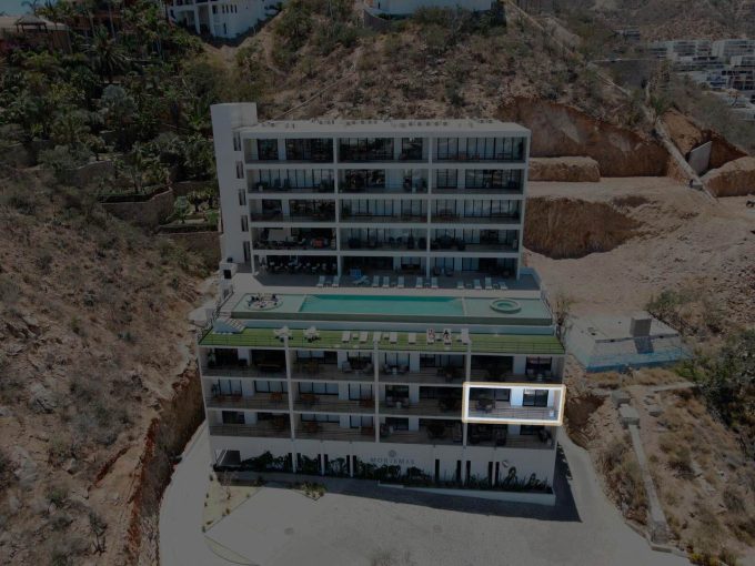 Luxurious Pedregal Condominium Building With A Rooftop Pool And Scenic Hillside Views In Los Cabos, Mexico. Modern Design, Spacious Balconies, And Exclusive Amenities In A Prime Location.