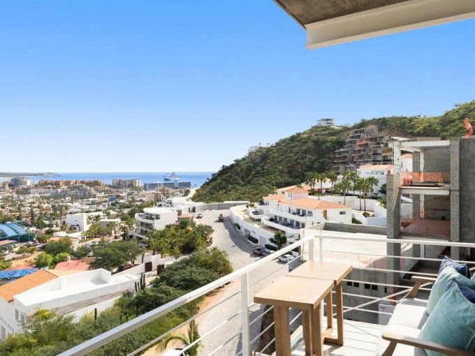 Spectacular View From Pedregal Luxury Condo Balcony Overlooking Ocean, Cityscape, And Hillside With Modern Architecture In Pedregal Real Estate Area, Perfect For Investment Or Rental Opportunity.