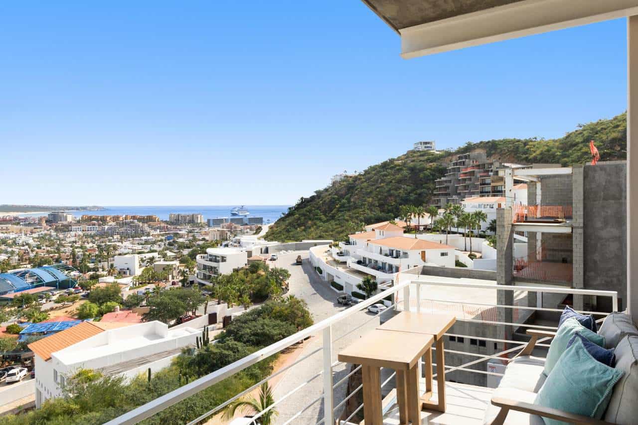 Spectacular View From Pedregal Luxury Condo Balcony Overlooking Ocean, Cityscape, And Hillside With Modern Architecture In Pedregal Real Estate Area, Perfect For Investment Or Rental Opportunity.