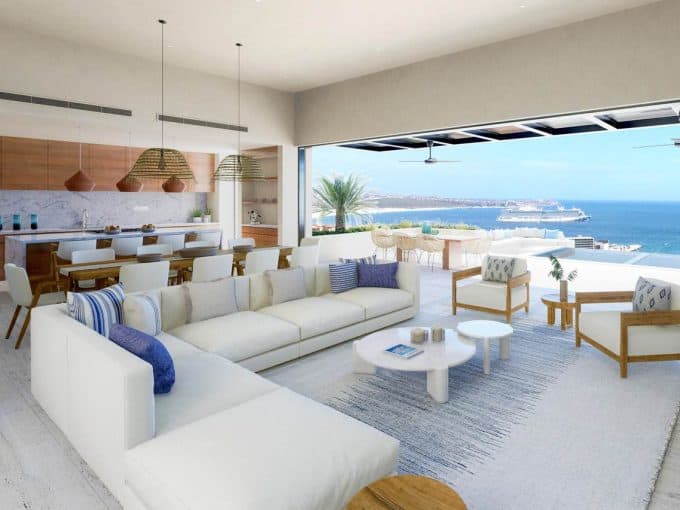 Luxurious Pedregal Beachfront Living Room With Expansive Ocean Views, Modern White Furniture, And Natural Wood Accents Offering Elegant Coastal Lifestyle.