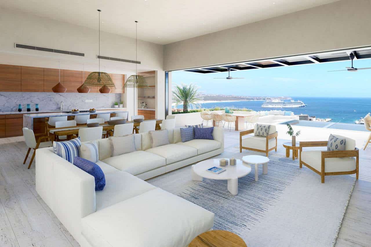 Luxurious Pedregal Beachfront Living Room With Expansive Ocean Views, Modern White Furniture, And Natural Wood Accents Offering Elegant Coastal Lifestyle.