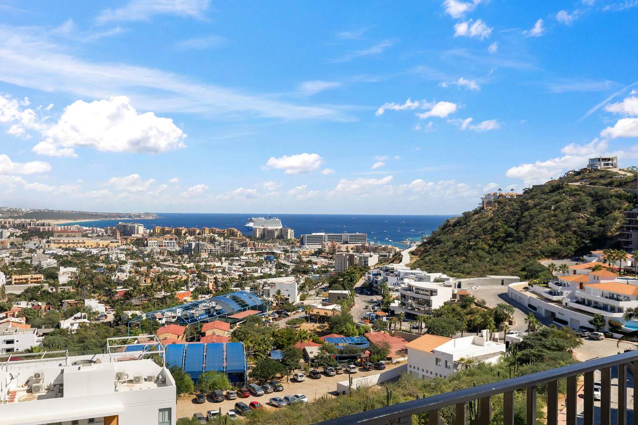 Vibrant View Of Pedregal With Ocean, City Skyline, And Lush Hillside, Showcasing Luxury Homes And Scenic Beauty In A Renowned Coastal Neighborhood.
