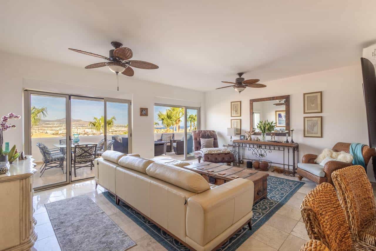 Pedregal Ocean View Hillside Living Room With Spacious Seating And Natural Light.