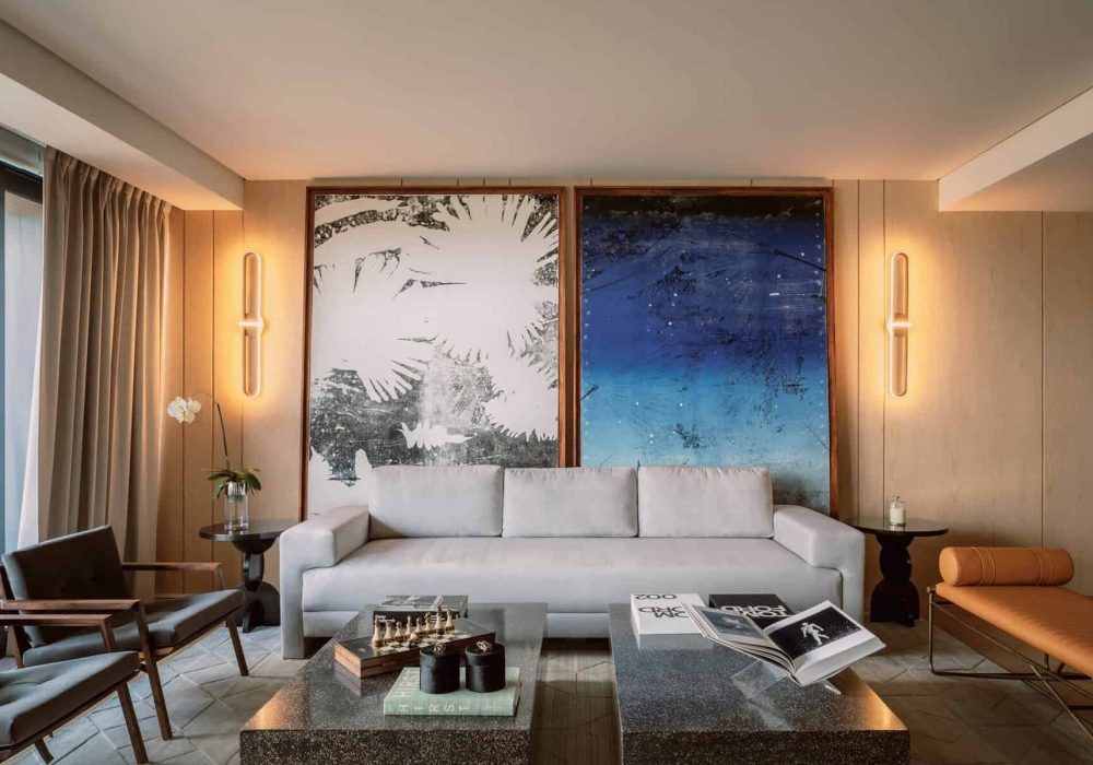 Luxurious Pedregal Interior Living Room With Modern Furniture, Large Artwork, Elegant Lighting, And Stylish Decor Featuring A White Sofa, Armchairs, Coffee Table, And Decorative Accents.
