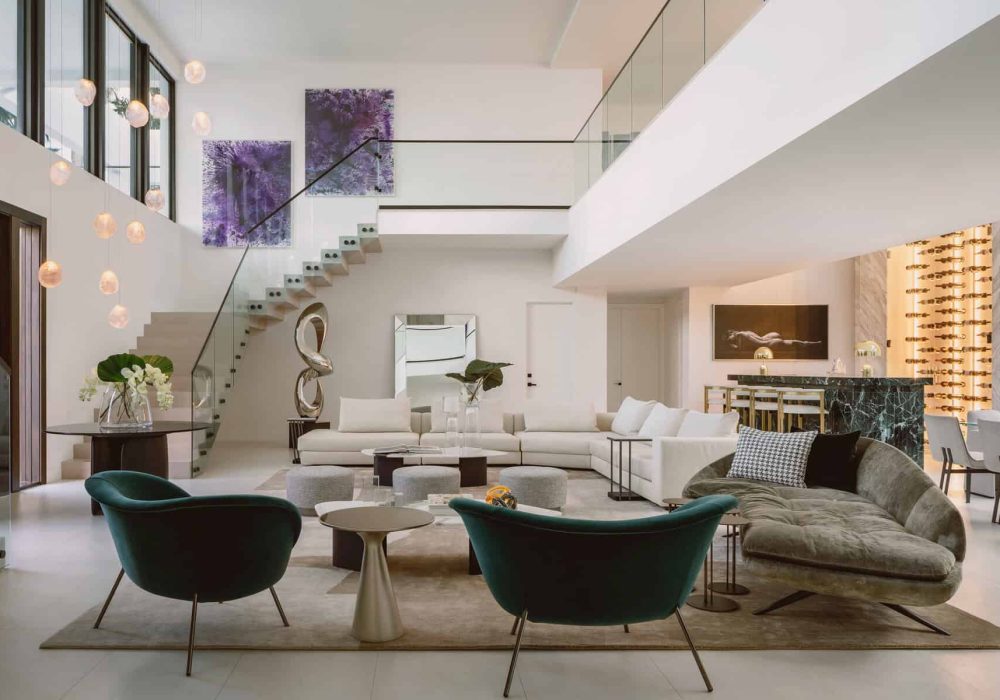 Luxurious Pedregal Living Room Featuring Modern White Sofas, Stylish Green And Velvet Chairs, Contemporary Artwork, And Elegant Decor In A Spacious, Open-Concept Design.