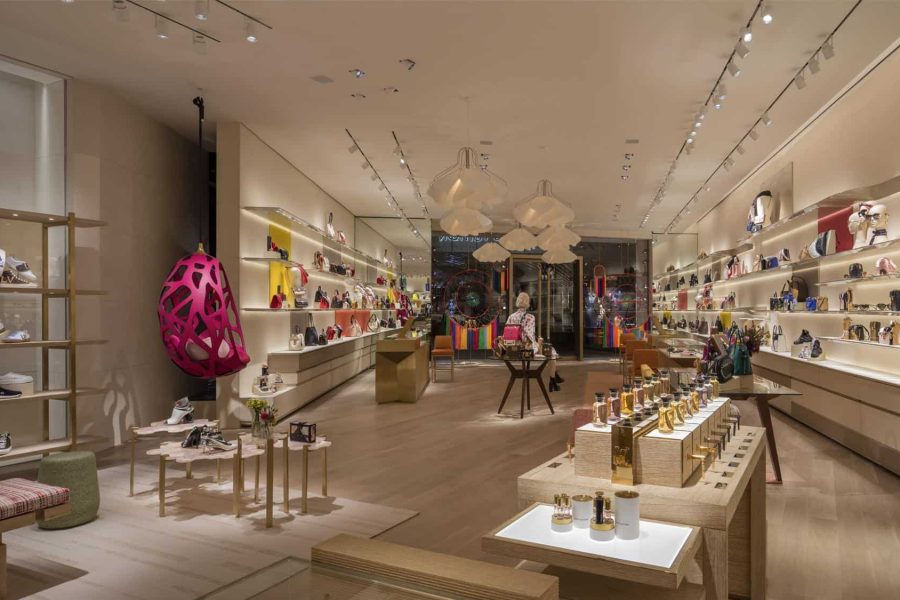 Bright Pedregal Real Estate Boutique Showcasing Stylish Shoes, Handbags, And Accessories With Elegant Lighting And Modern Decor In A Luxurious Setting.