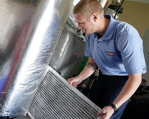 Technician Changing Furnace Filter-5X4-1 (1)