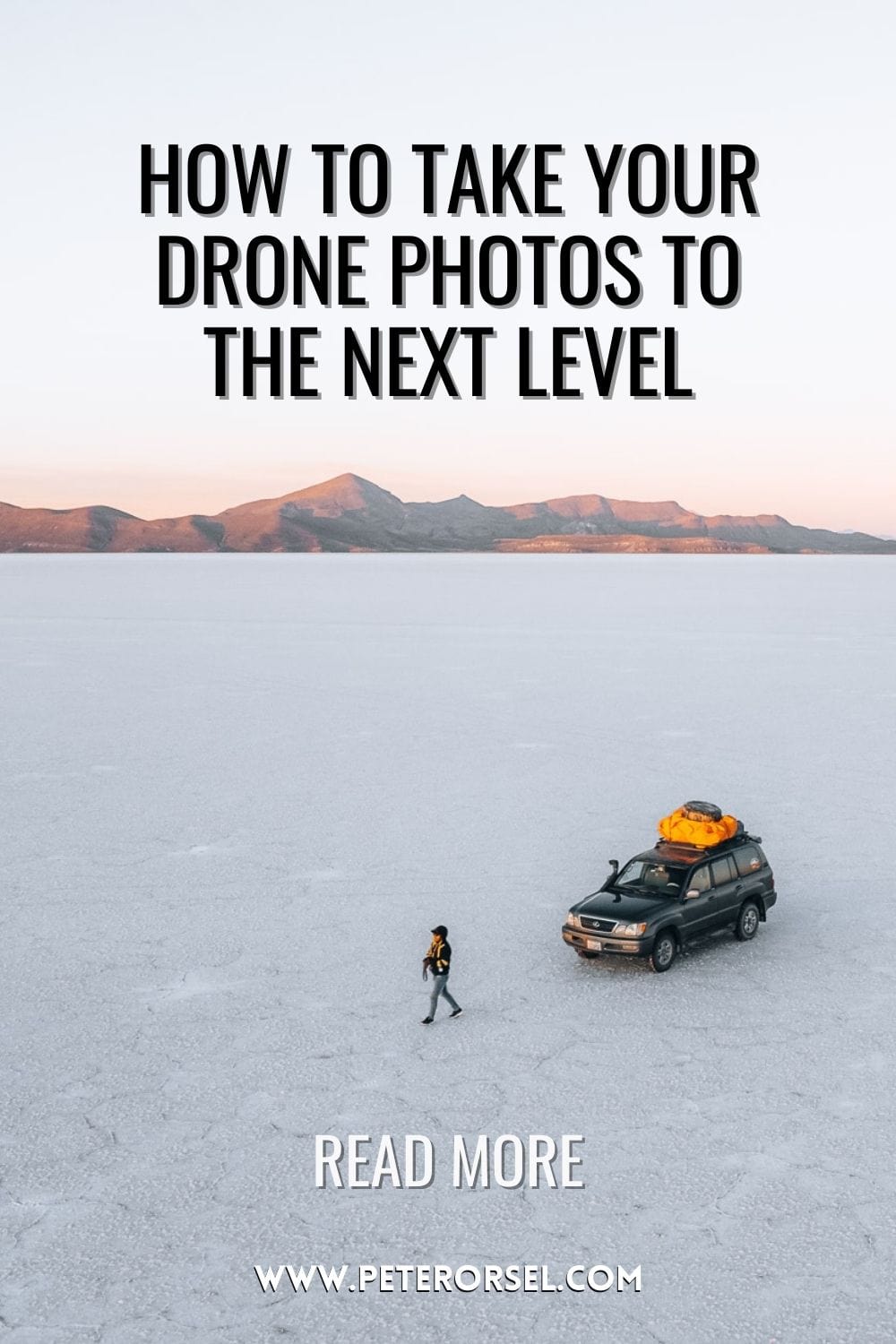 Photo of person walking and a car on salt flats in Bolivia