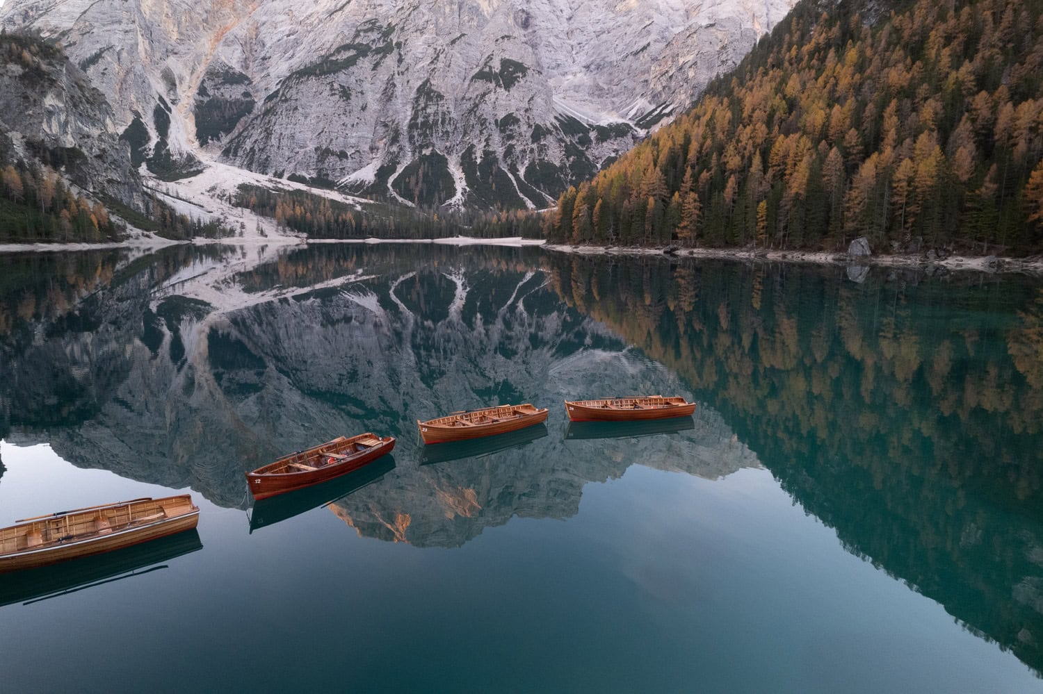 boats in a lake with amazing mountain view