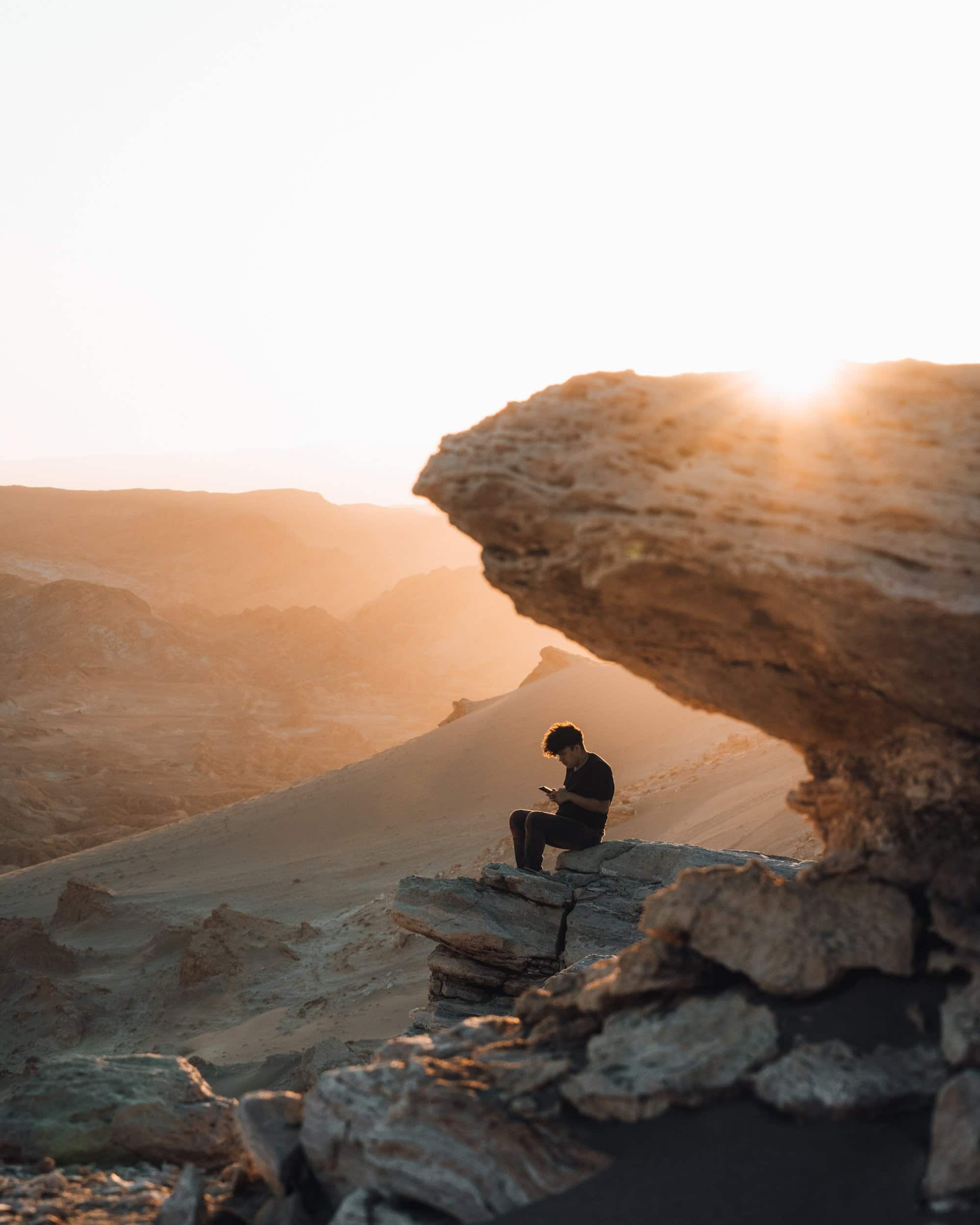 Man sitting by the cliff