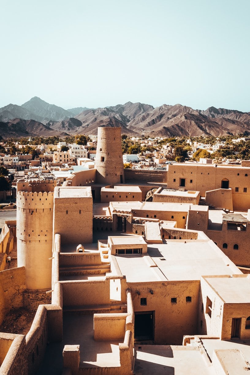 buildings in oman with mountain view