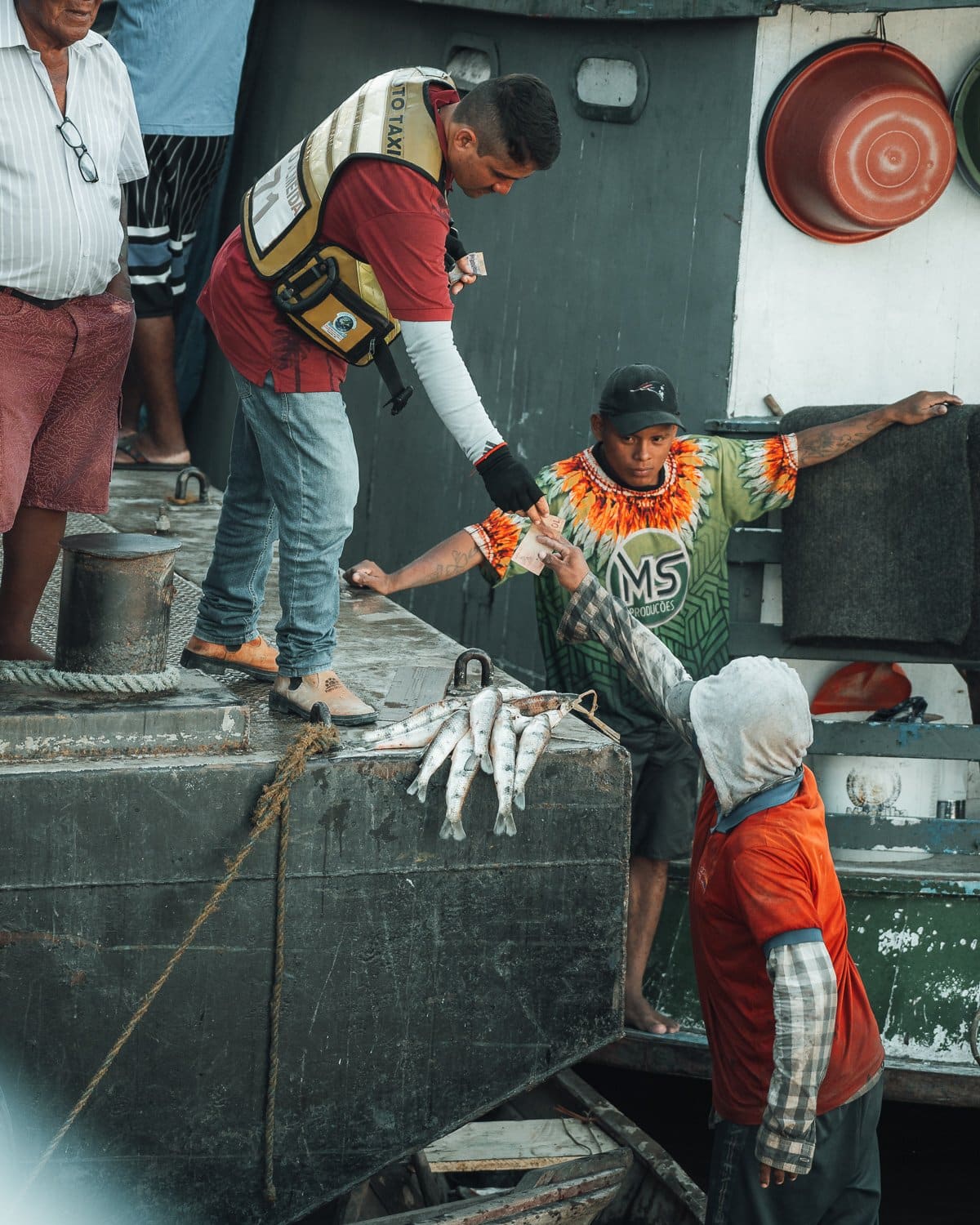 Man handing money to another man