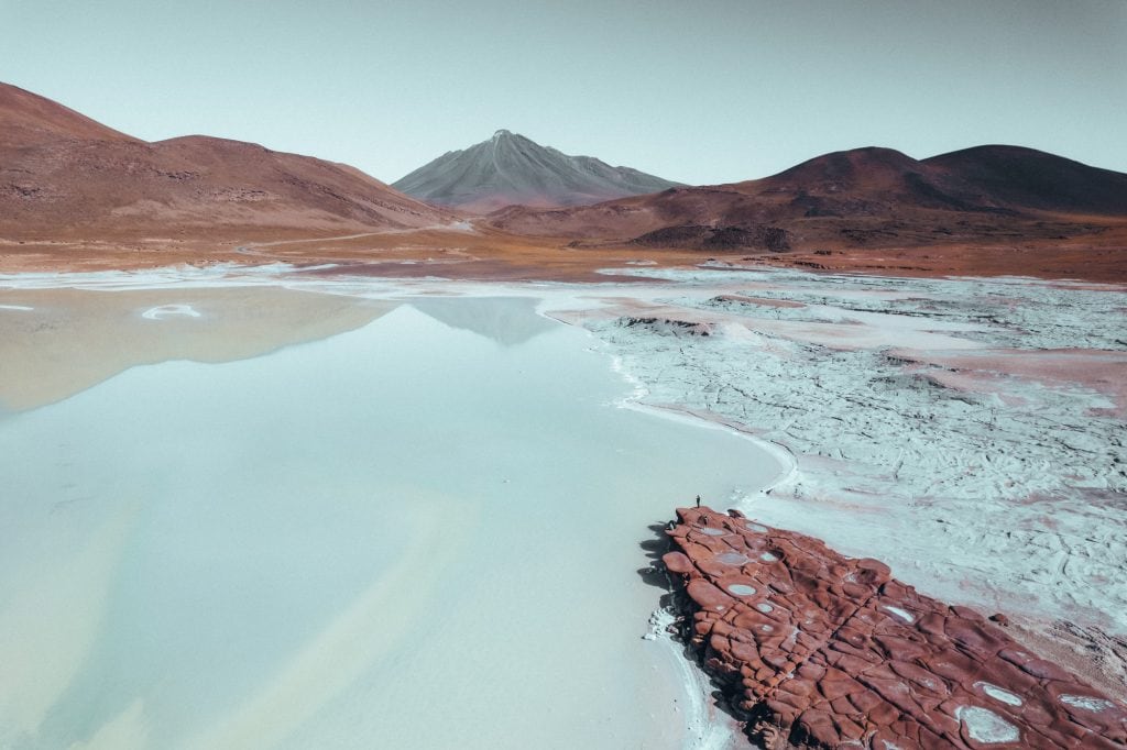 salt lagoon in atacama with mountain view