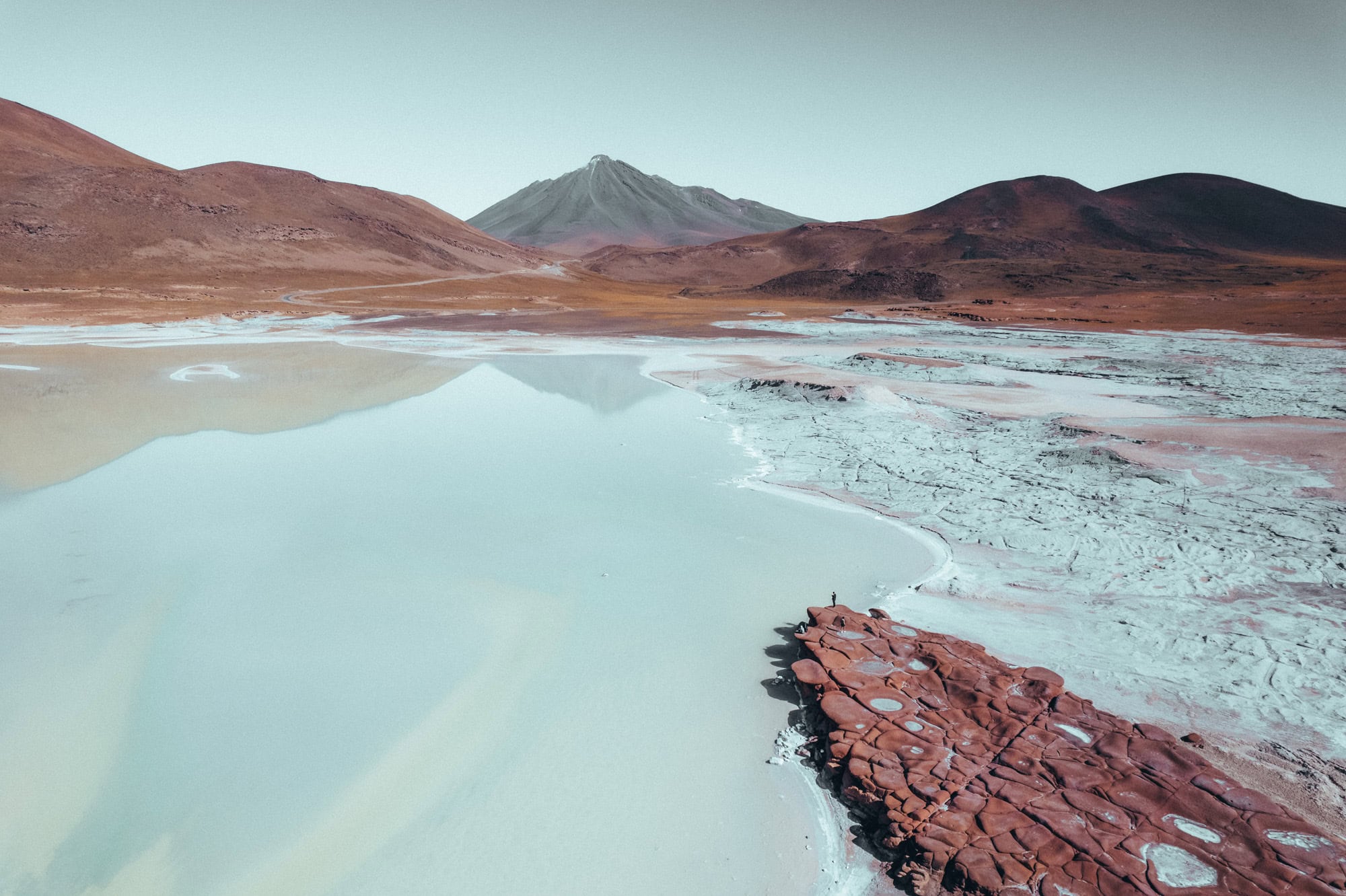 salt lagoon in atacama with mountain view